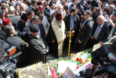 Ilia II, the Patriarch of Georgia, holds funeral rites at the April 9 memorial yesterday